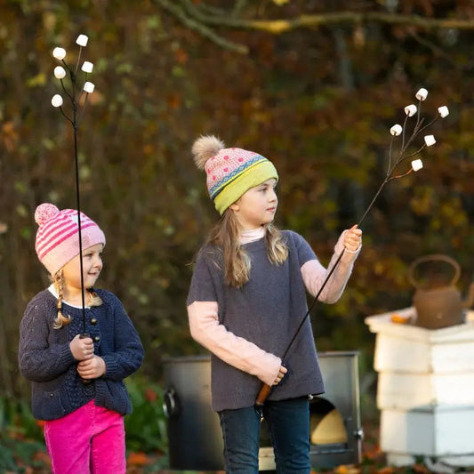 Cooking over an open fire pit with long handled fork