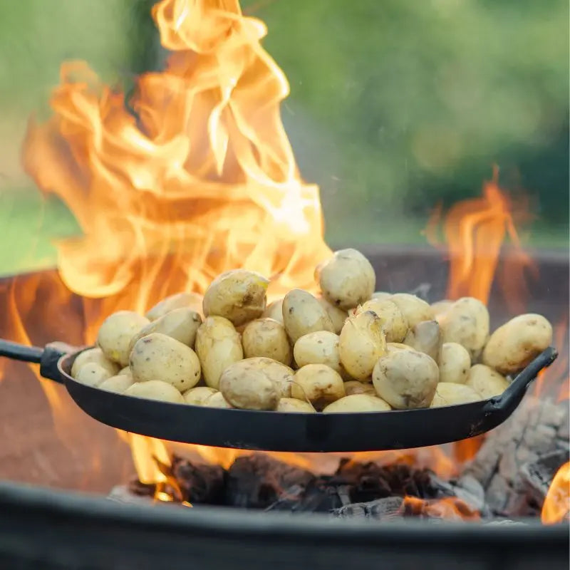 Firepits UK Long Handled Pan cooking outdoors