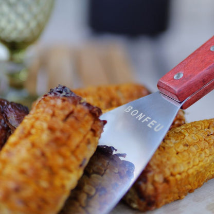BonFeu Spatula turning corn on the grill