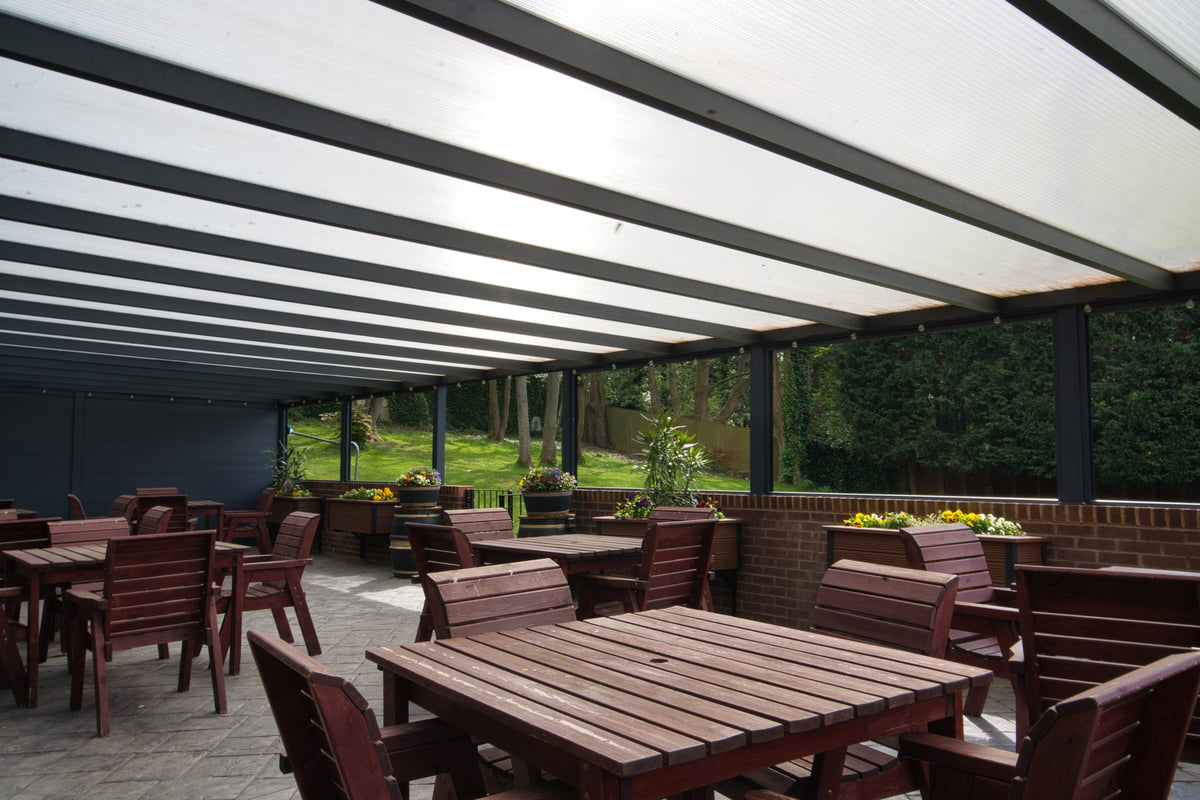 Deponti Bosco aluminium canopy fitted over a garden patio