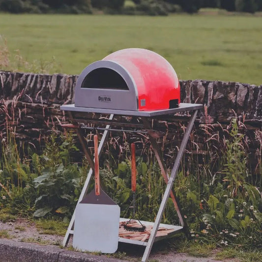 DeliVita Chilli Red wood fired pizza oven, lifestyle shot 1