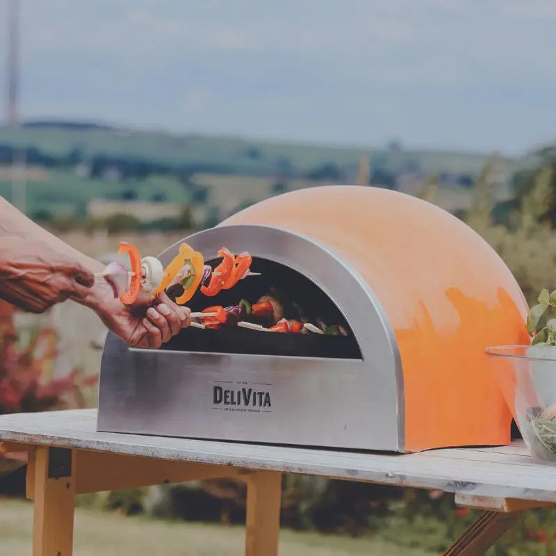 DeliVita Orange Blaze wood fired pizza oven, lifestyle shot 3