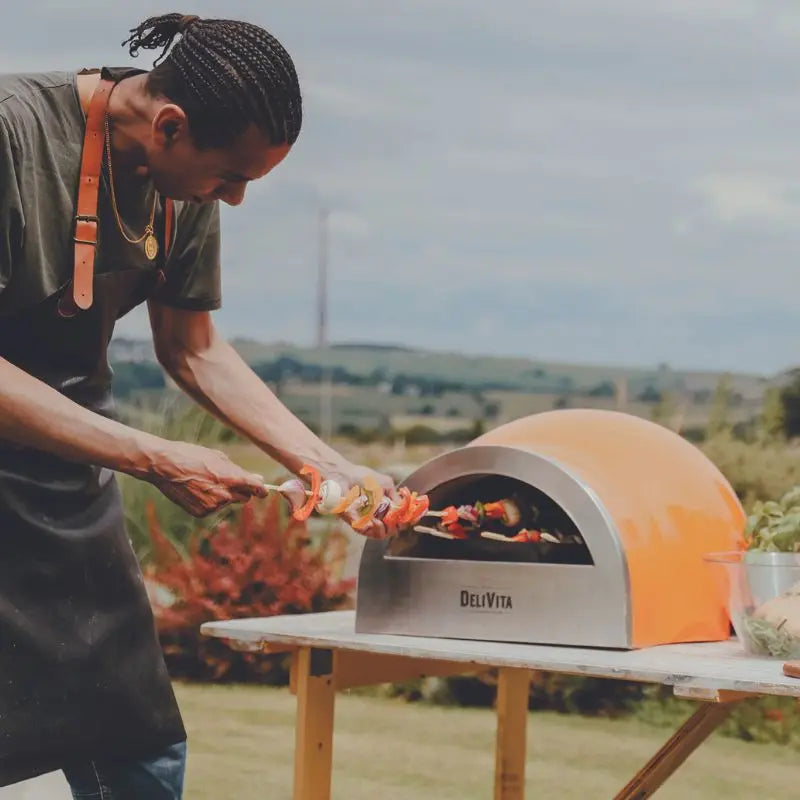 DeliVita Orange Blaze wood fired pizza oven, lifestyle shot 4