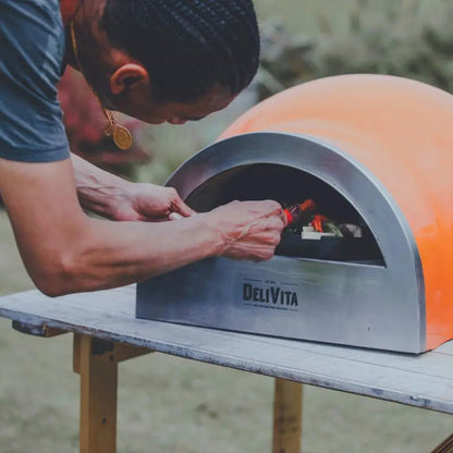DeliVita Orange Blaze wood fired pizza oven, lifestyle shot 5