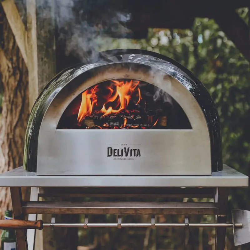 DeliVita Very Black wood fired pizza oven, lifestyle shot 2
