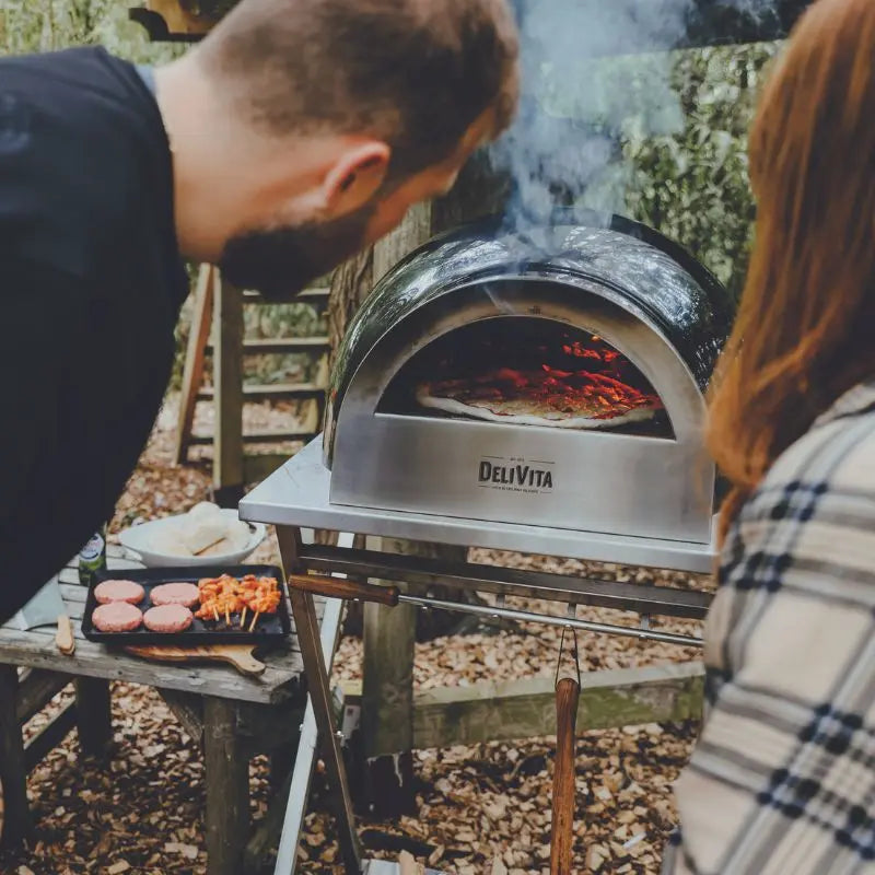 DeliVita Very Black wood fired pizza oven, lifestyle shot 4
