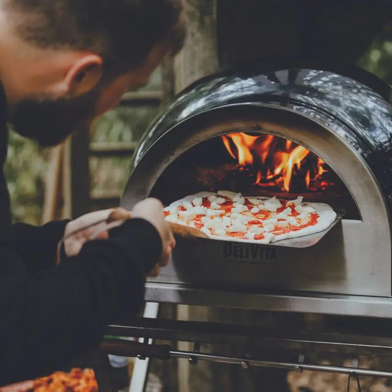 DeliVita Very Black wood fired pizza oven, lifestyle shot 6