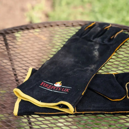 Firepits UK Fire Pit BBQ Gloves in black, in use