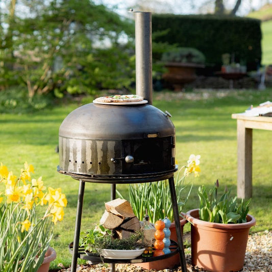 Firepits UK Dome Pizza Oven in garden setting