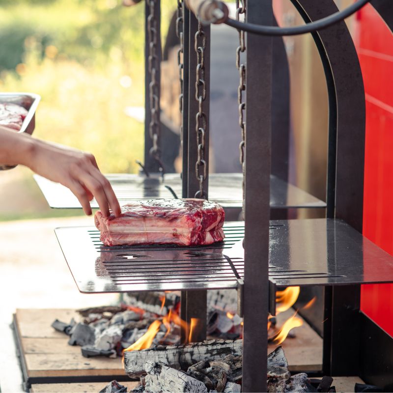 Firepits UK Katherine Wheel Dual BBQ grilling meat, view 2