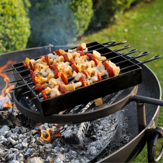 Firepits UK Kebab Rack grilling kebabs over a fire pit