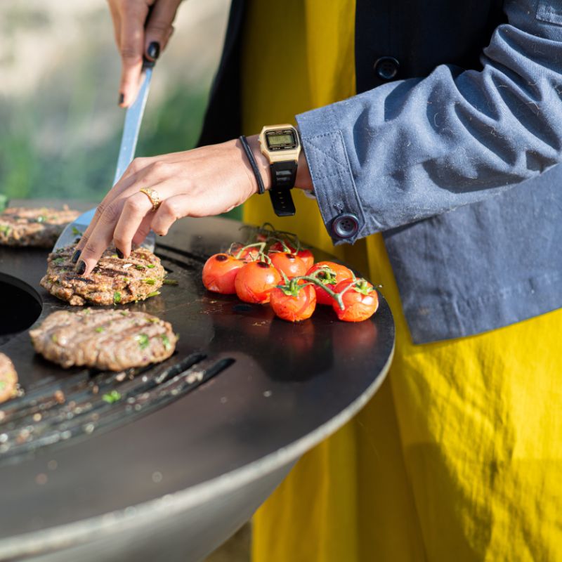 Firepits UK Plancha Fire Pit with burgers and tomatoes