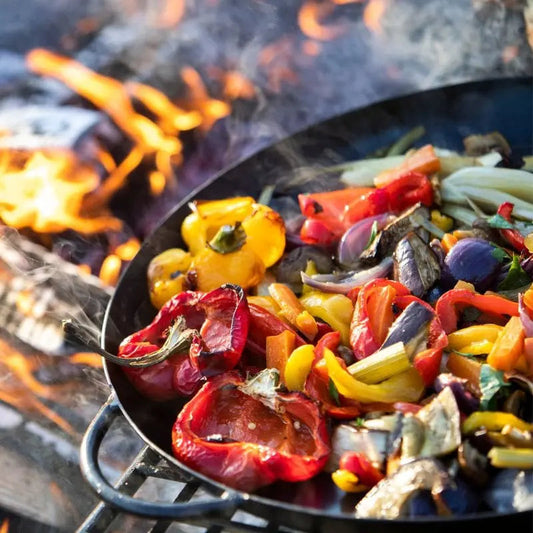 Firepits UK Skillet Pan in use over a fire pit