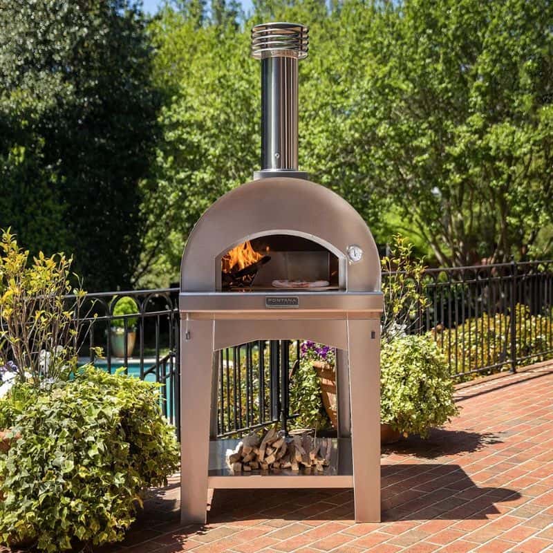Fontana wood fired pizza oven in a garden entertaining setting