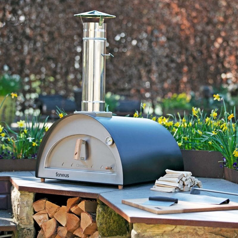 Igneus Classico wood fired pizza oven in black, lifestyle shot